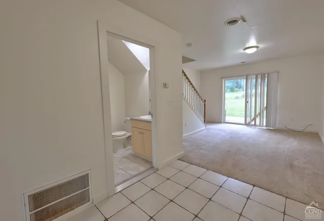 a bathroom with a sink a toilet and mirror