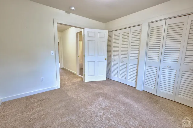 a front view of house with yard and outdoor seating