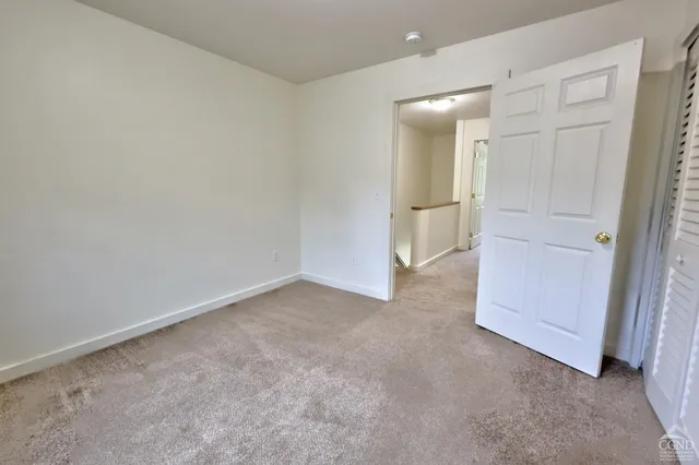 a front view of house with yard and trees