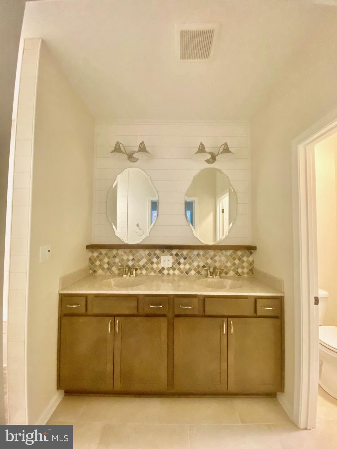 741 Fable Road Hedgesville, WV 25427 - Photo 14 of 22 Primary bathroom with double sinks and