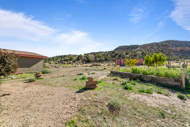 3135 North Thompson Cyn Road Green River, UT 84525 - Photo 34 of 41 View of yard with an outbuilding
