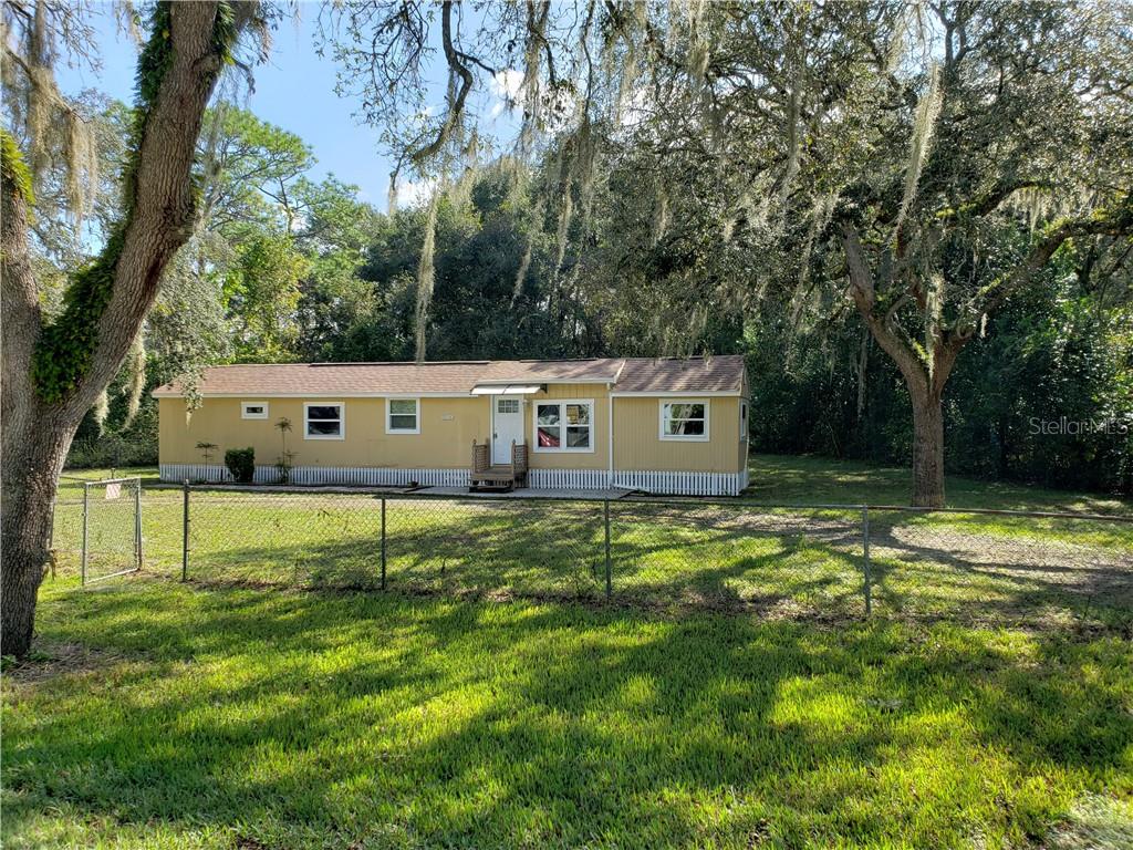 5134 Strickland Trail Ridge Manor, FL 33523 - Photo 1 of 1 a view of a house with a yard