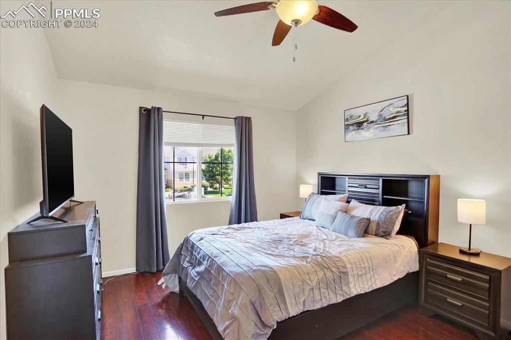 1776 Reilly Grove Colorado Springs, CO 80951 - Photo 12 of 21 a bedroom with a bed and a flat tv screen on a dresser