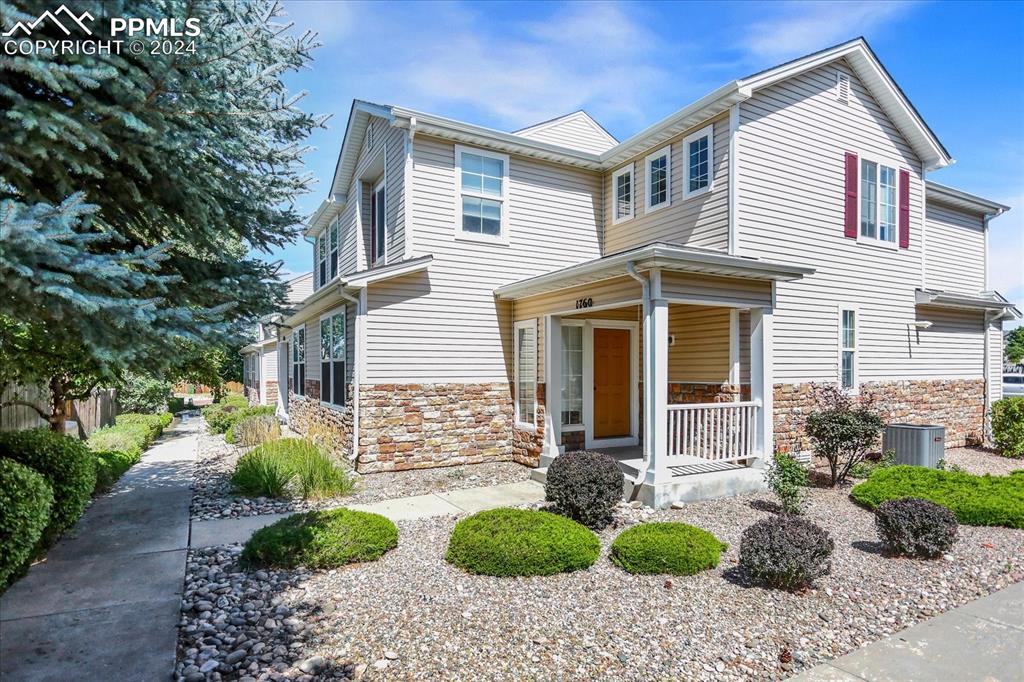 1776 Reilly Grove Colorado Springs, CO 80951 - Photo 2 of 21 a front view of a house with garden