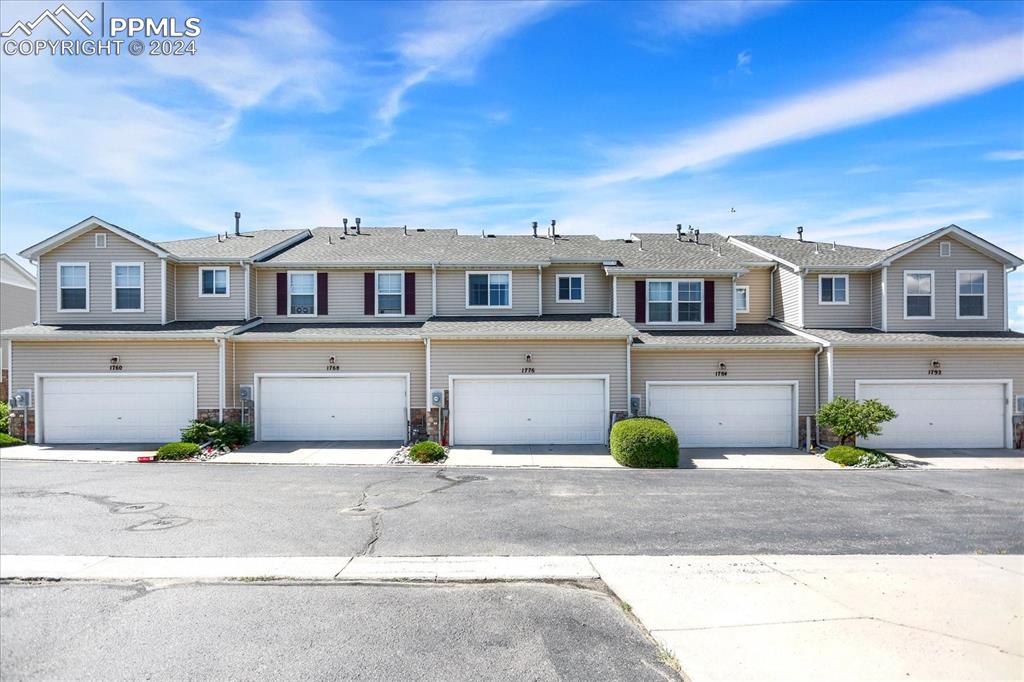 1776 Reilly Grove Colorado Springs, CO 80951 - Photo 21 of 21 a front view of a house with a yard
