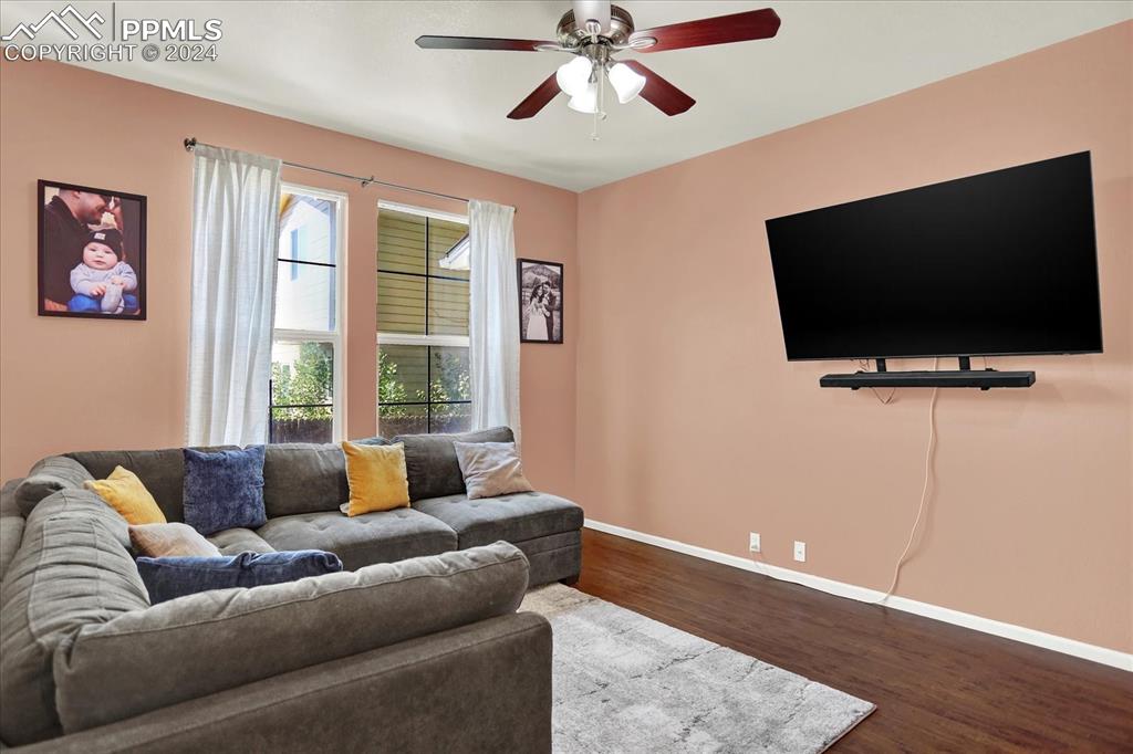 1776 Reilly Grove Colorado Springs, CO 80951 - Photo 4 of 21 a living room with furniture and a flat screen tv