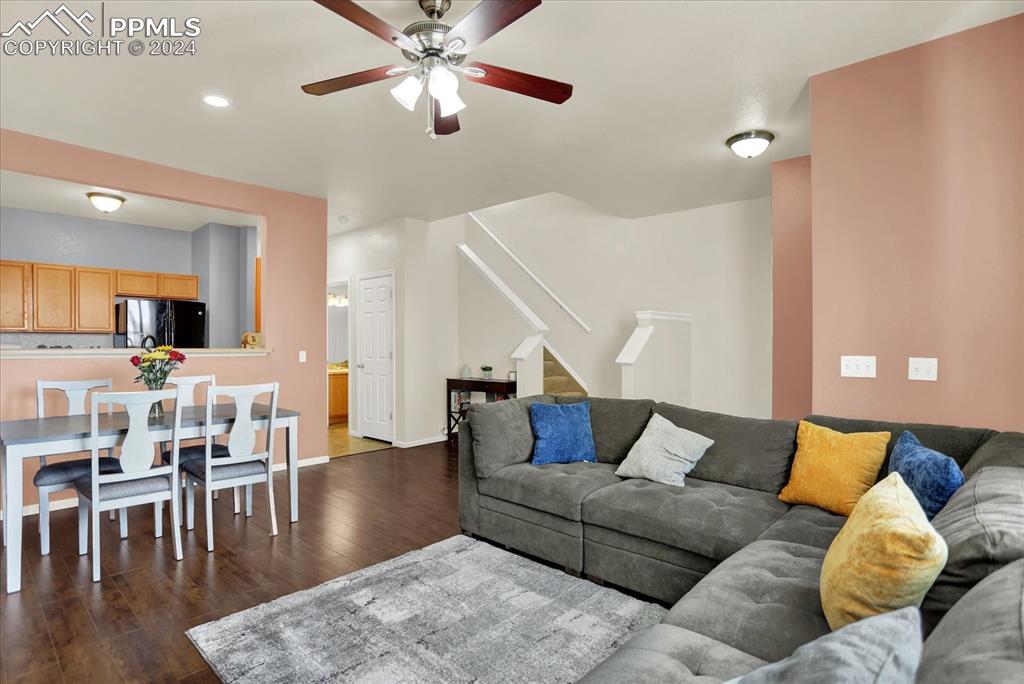 1776 Reilly Grove Colorado Springs, CO 80951 - Photo 5 of 21 a living room with furniture and wooden floor