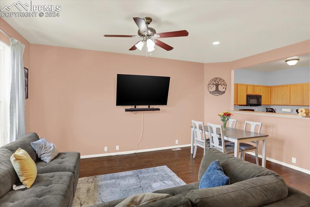 1776 Reilly Grove Colorado Springs, CO 80951 - Photo 6 of 21 a living room with furniture and a flat screen tv
