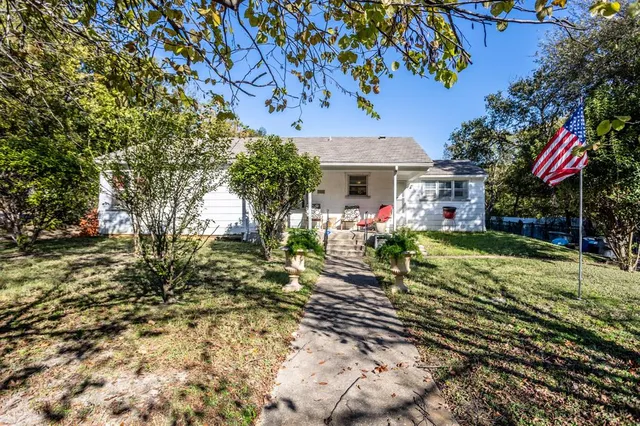 a view of house with yard