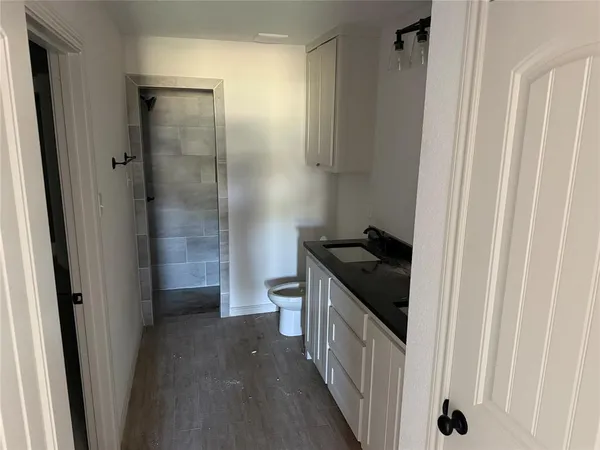 a kitchen with a sink and a refrigerator