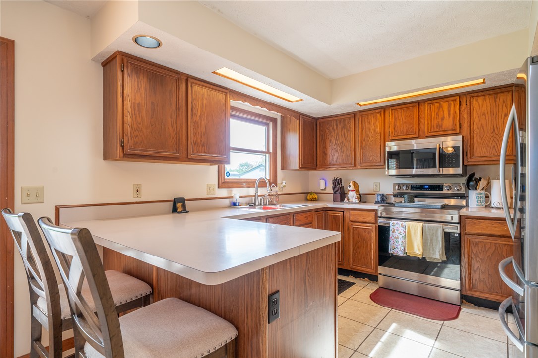 3628 Petre Road Springfield, OH 45502 - Photo 7 of 52 This functional kitchen features ample cabinetry and a convenient breakfast bar perfect for casual dining.