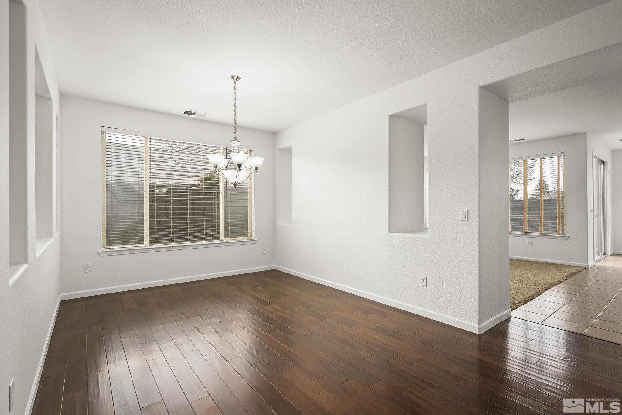 485 Haleb Court Reno, NV 89521 - Photo 8 of 34 a view of wooden floor and a chandelier in a room