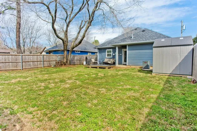 a view of a house with backyard porch and sitting area