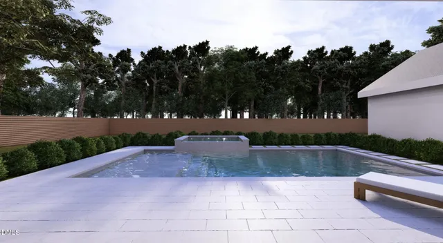 an aerial view of a house with a garden