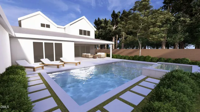 a view of a swimming pool with a yard