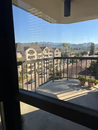 a view of a balcony with city view