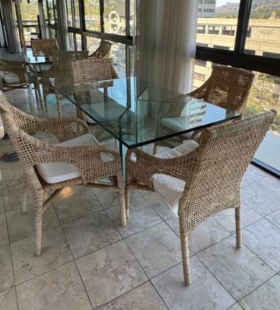 a view of a patio with table and chairs