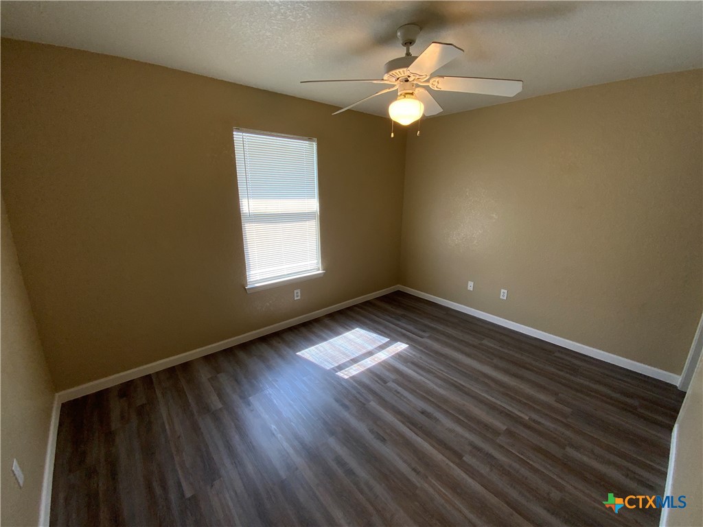 2602 Edgefield Street, Unit B Killeen, TX 76549 - Photo 11 of 12 a view of empty room with wooden floor and fan