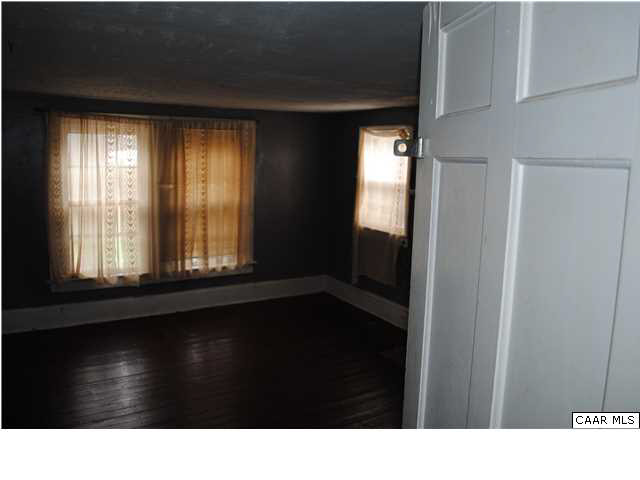 870 Black Cat Road Keswick, VA 22947 - Photo 13 of 18 a black and white photo of a room