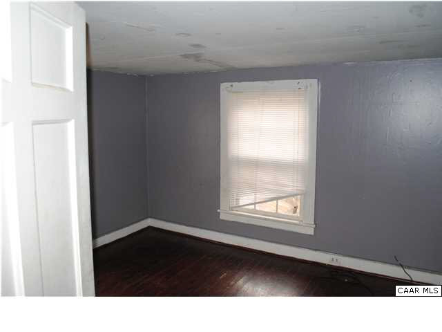 870 Black Cat Road Keswick, VA 22947 - Photo 15 of 18 a black and white view of an empty room with a window