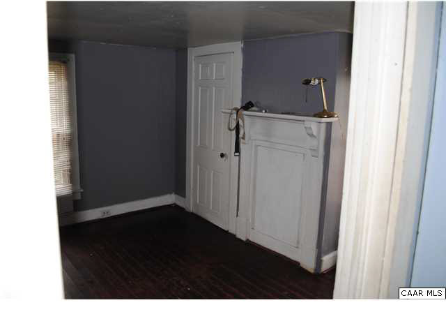 870 Black Cat Road Keswick, VA 22947 - Photo 16 of 18 a black and white wall with white cabinets