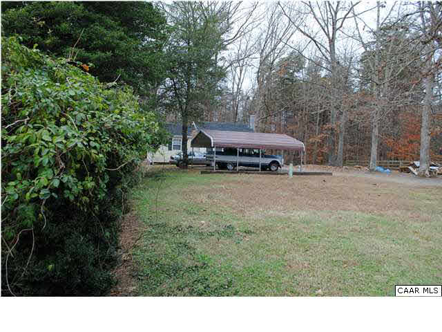 870 Black Cat Road Keswick, VA 22947 - Photo 18 of 18 a view of a house with a yard