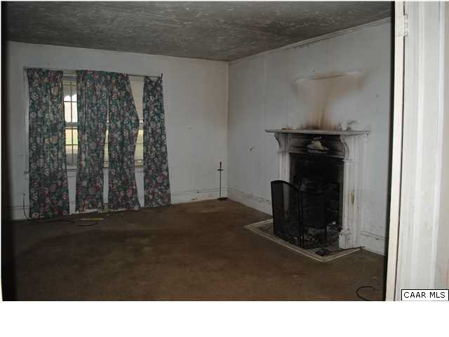 870 Black Cat Road Keswick, VA 22947 - Photo 6 of 18 a black and white room with wooden floor