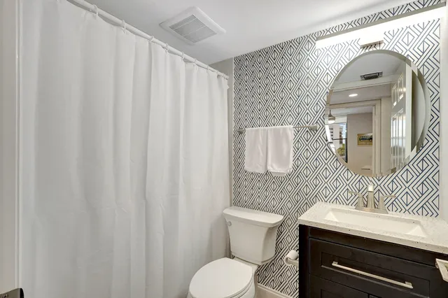 a view of a balcony with chairs