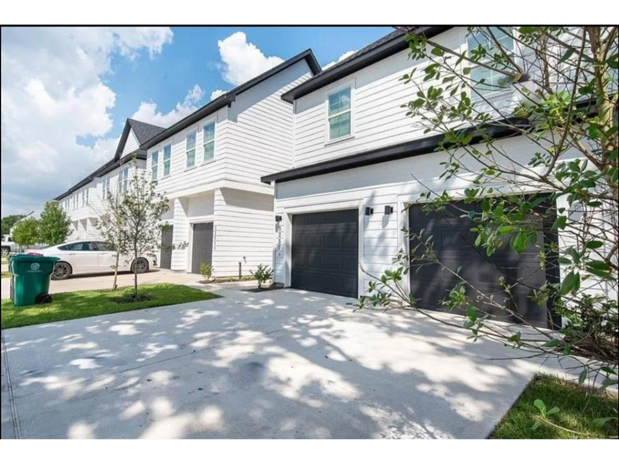 3233 Real Street, Unit A Houston, TX 77087 - Photo 1 of 12 a view of a house with a yard and garage