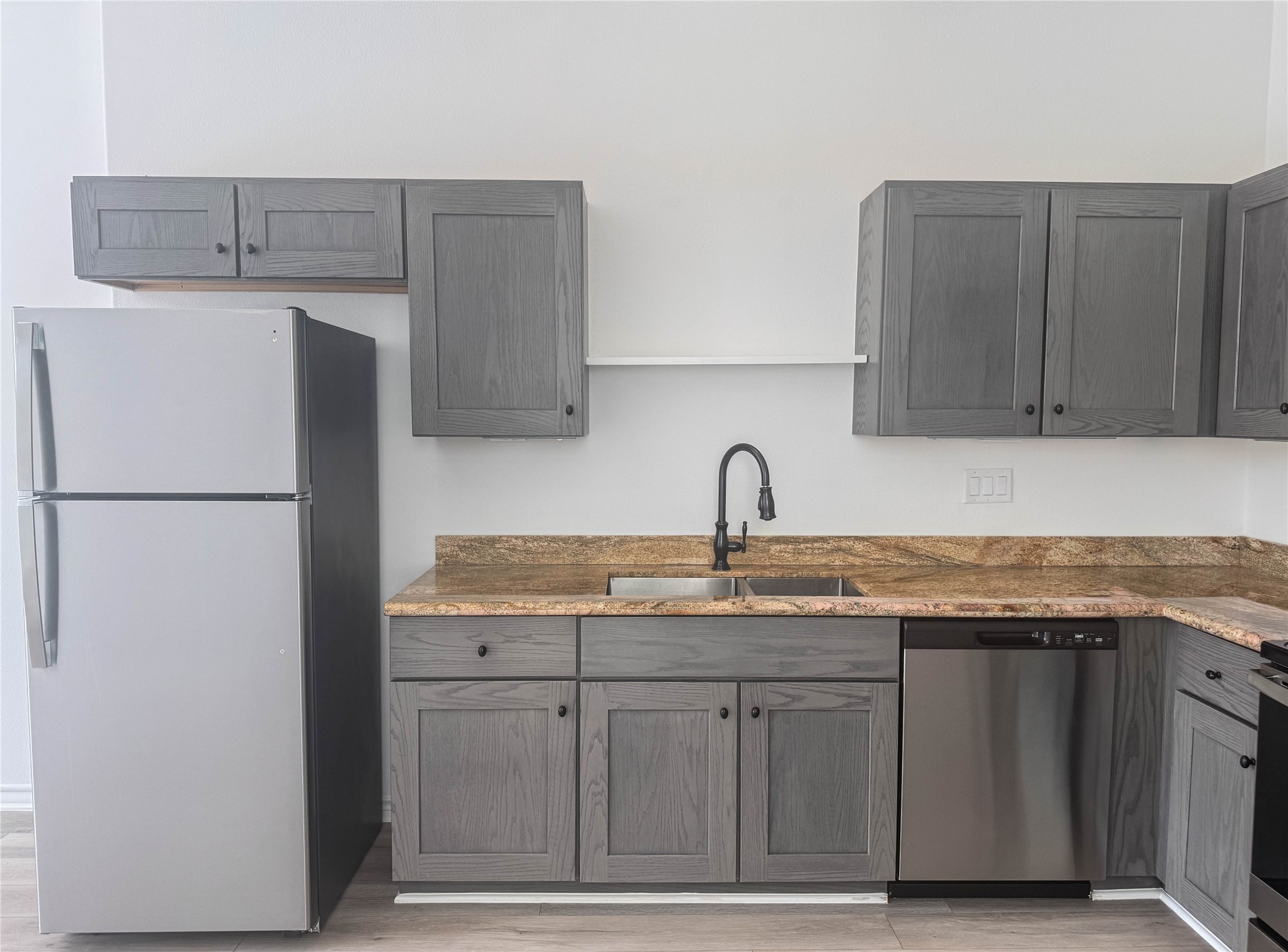 3233 Real Street, Unit A Houston, TX 77087 - Photo 3 of 12 a kitchen with a sink and a refrigerator