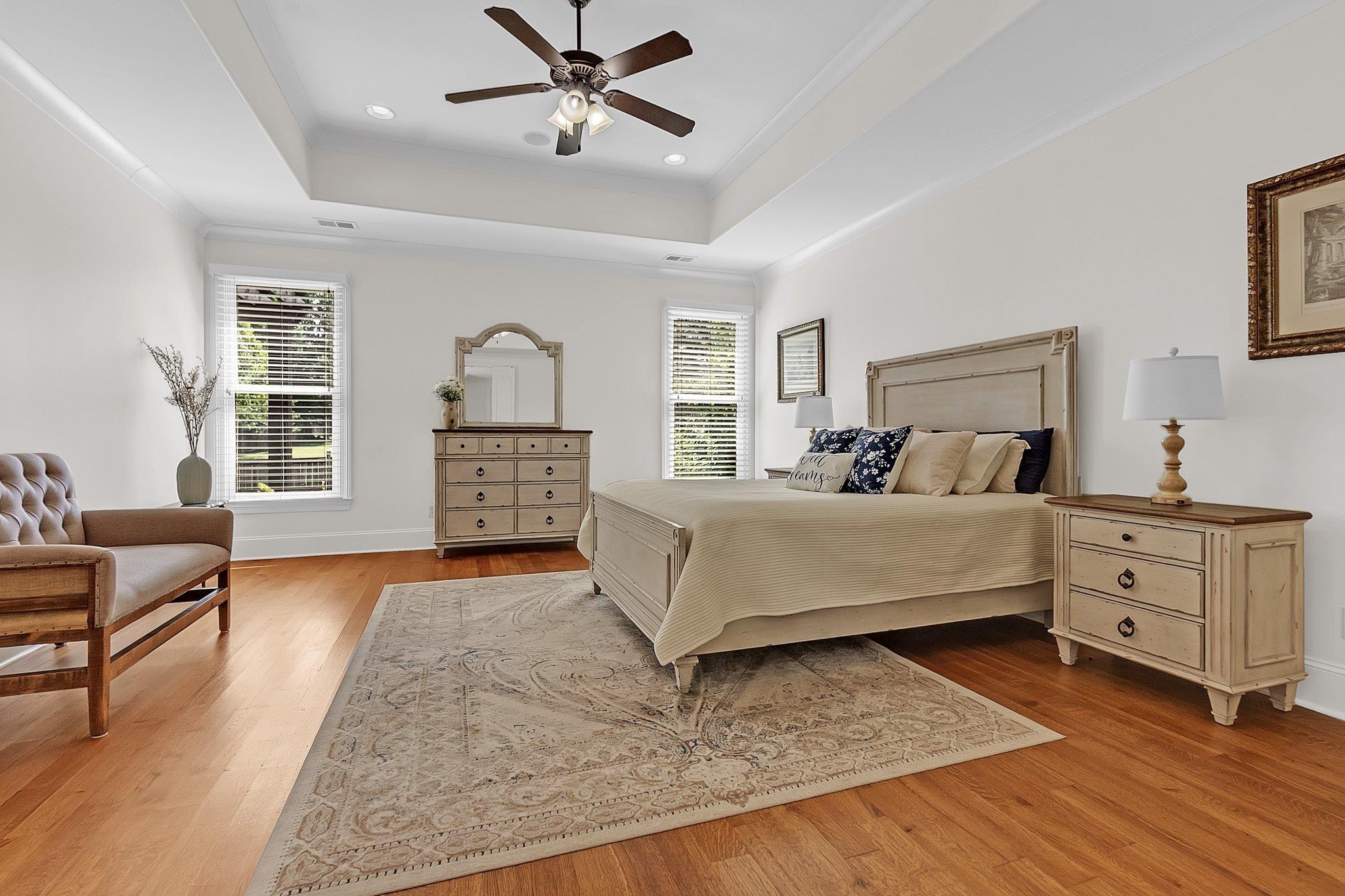 3246 North Hartwell Ridge Drive Collierville, TN 38017 - Photo 22 of 40 Hardwood flooring and a tray ceiling with a ceiling fan