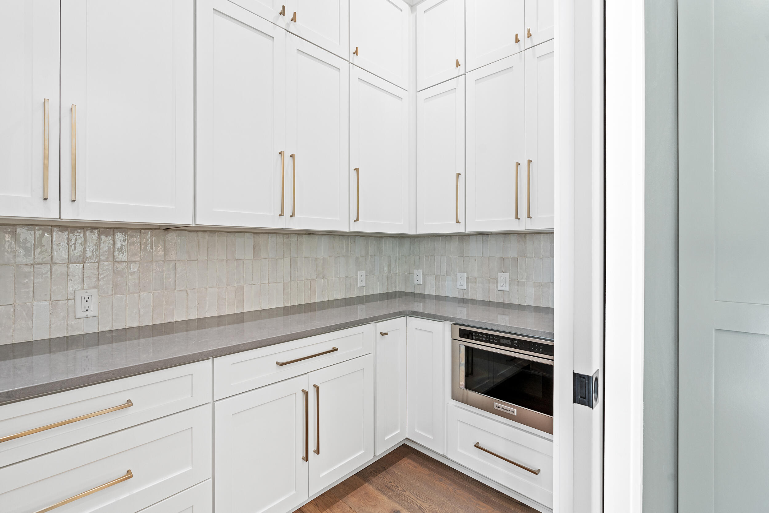 22 Junop Court Santa Rosa Beach, FL 32459 - Photo 12 of 80 a kitchen with white cabinets and white appliances