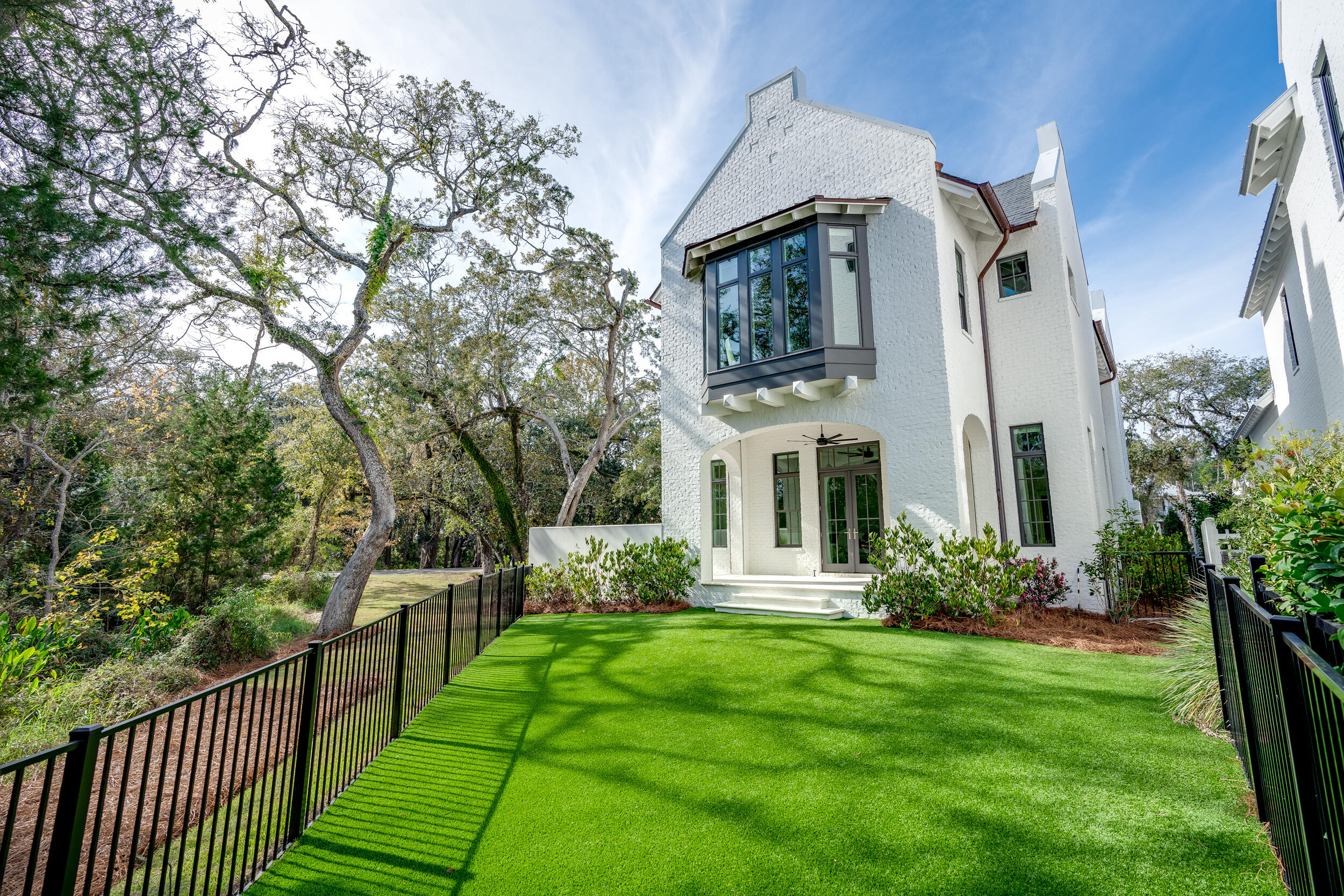 22 Junop Court Santa Rosa Beach, FL 32459 - Photo 55 of 80 a view of a house with brick walls and a yard with plants