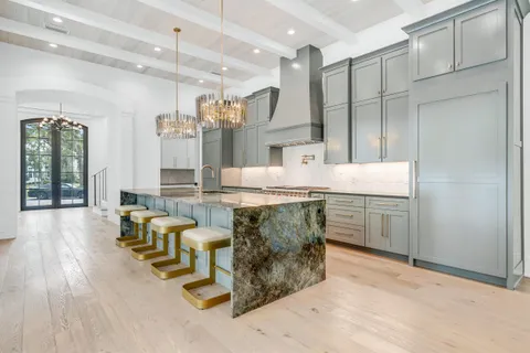 a view of staircase with railing and a window