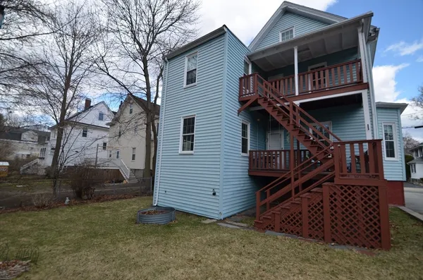 a view of a house with a yard