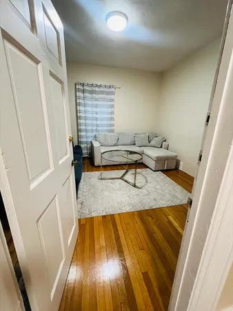 a living room with furniture and a rug
