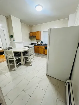 a view of kitchen with furniture and window