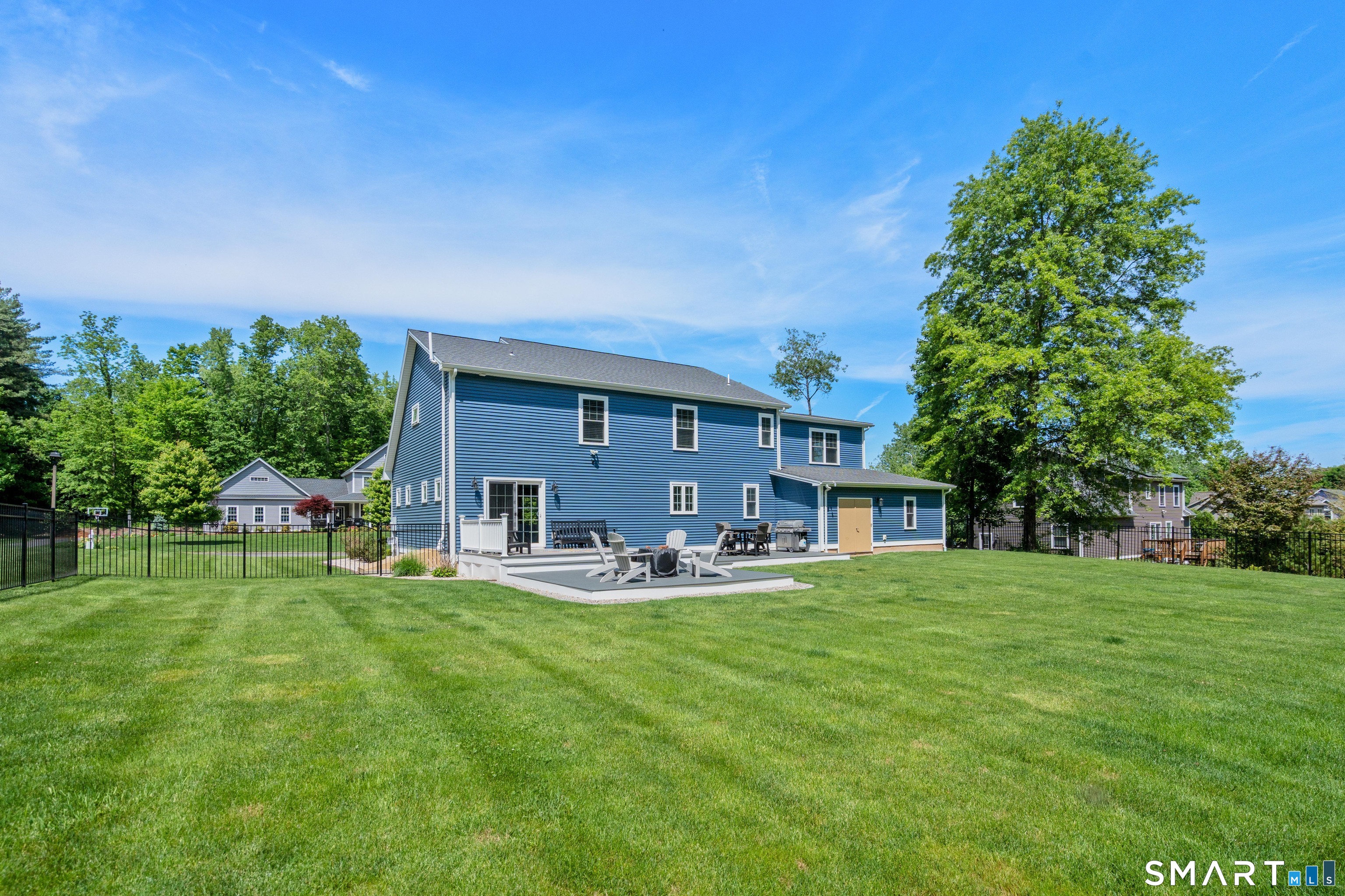 5 Limric Lane Suffield, CT 06078 - Photo 32 of 36 a house view with a sitting space and garden