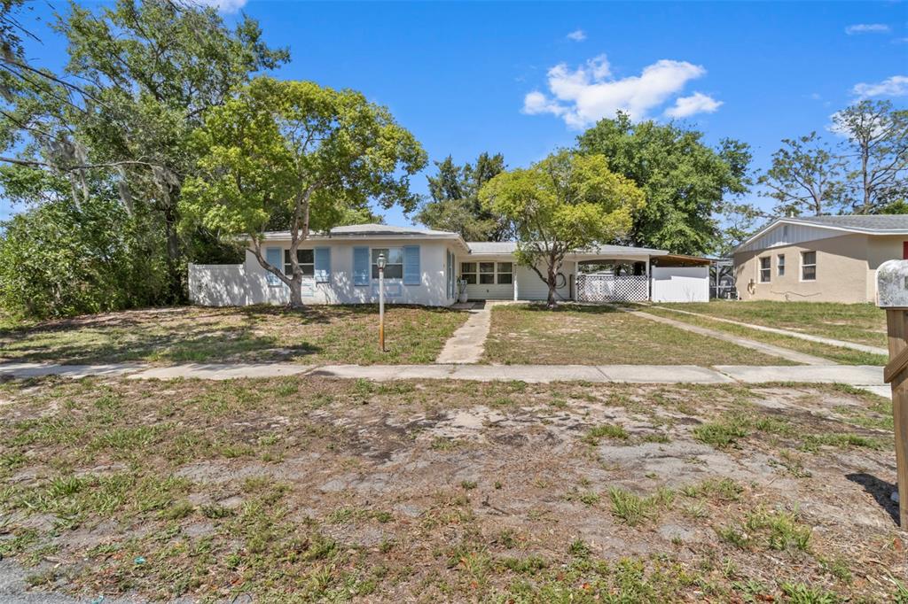 6221 Dalton Street Spring Hill, FL 34606 - Photo 34 of 40 a view of a house with a yard