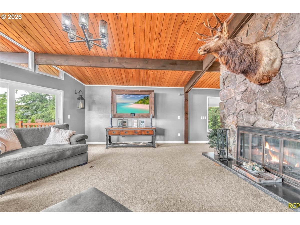 59887 Westhill Road St. Helens, OR 97051 - Photo 13 of 44 a living room with furniture and a fireplace