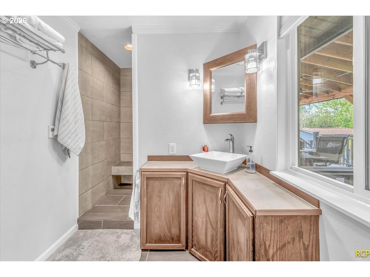 59887 Westhill Road St. Helens, OR 97051 - Photo 20 of 44 a view of a bathroom with a sink and a bath tub