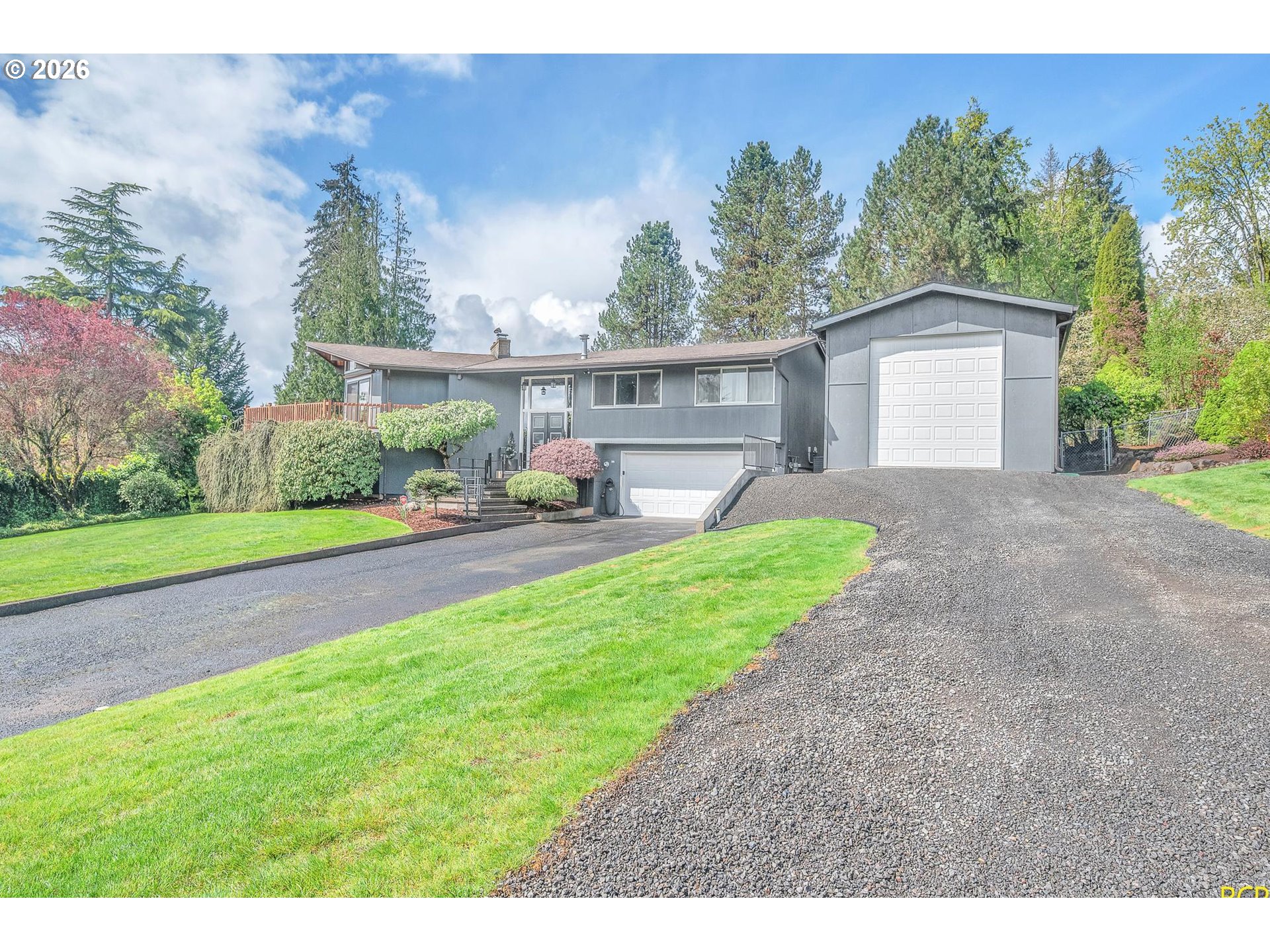 59887 Westhill Road St. Helens, OR 97051 - Photo 2 of 44 a house view with a garden space
