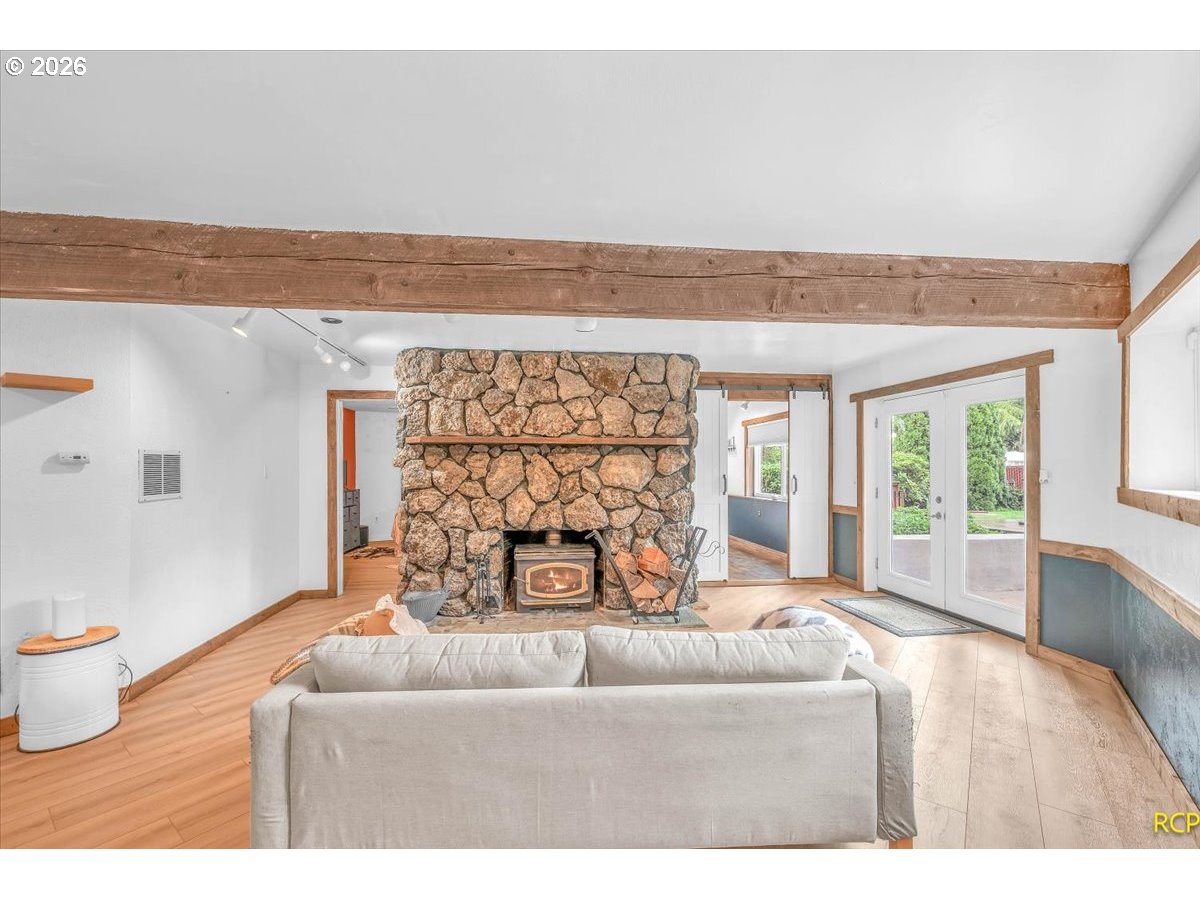 59887 Westhill Road St. Helens, OR 97051 - Photo 26 of 44 a living room with furniture and a fireplace
