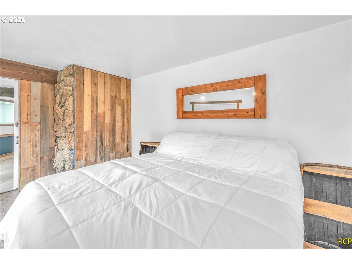 59887 Westhill Road St. Helens, OR 97051 - Photo 29 of 44 a bedroom with a bed and a painting