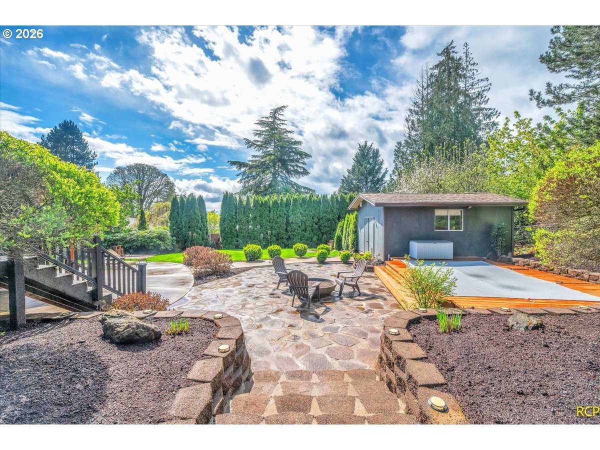 59887 Westhill Road St. Helens, OR 97051 - Photo 39 of 44 a view of a house with backyard and sitting area