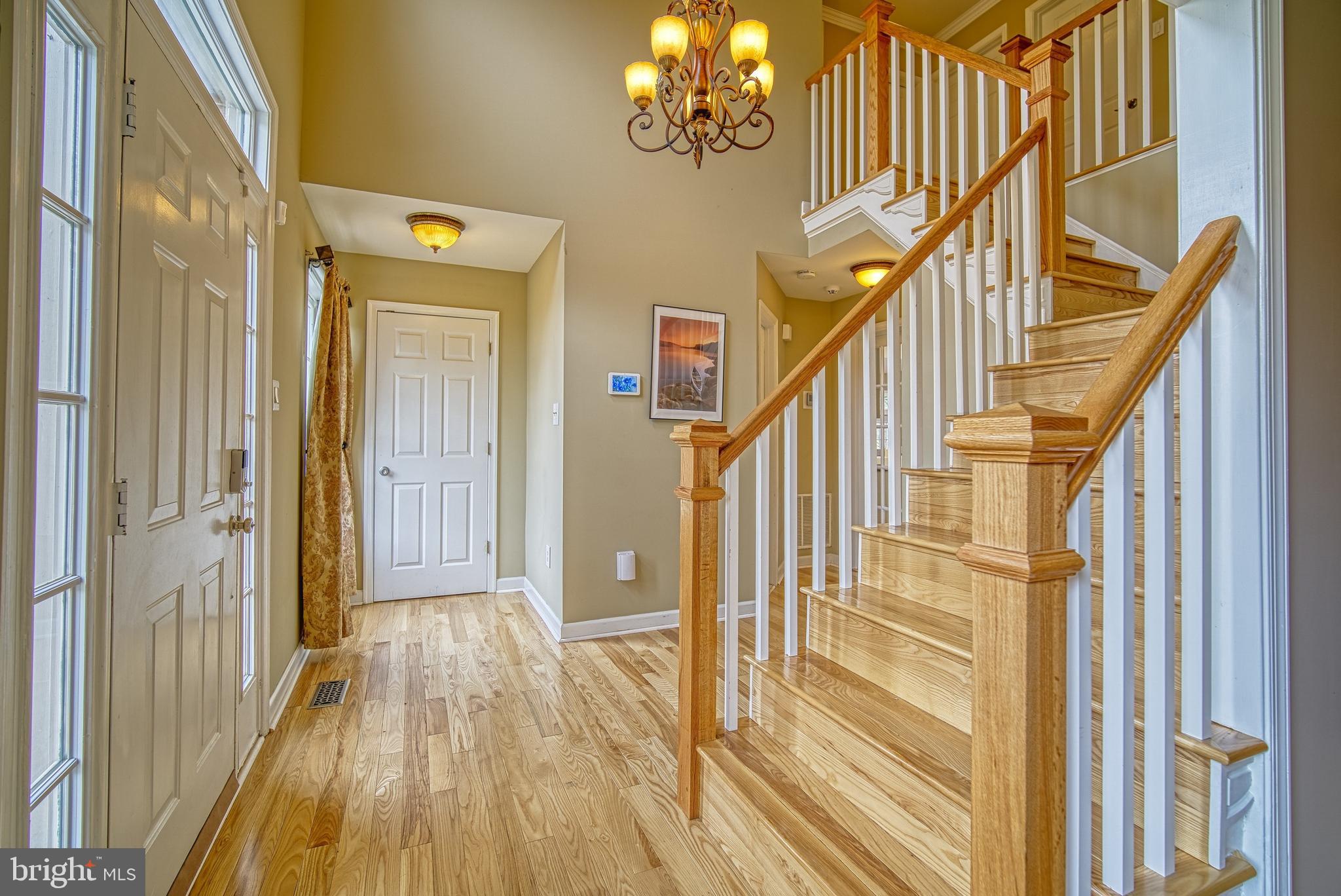 14539 Cutstone Way Silver Spring, MD 20905 - Photo 17 of 34 Lovely new Ash hardwoods stairs & railings welcome