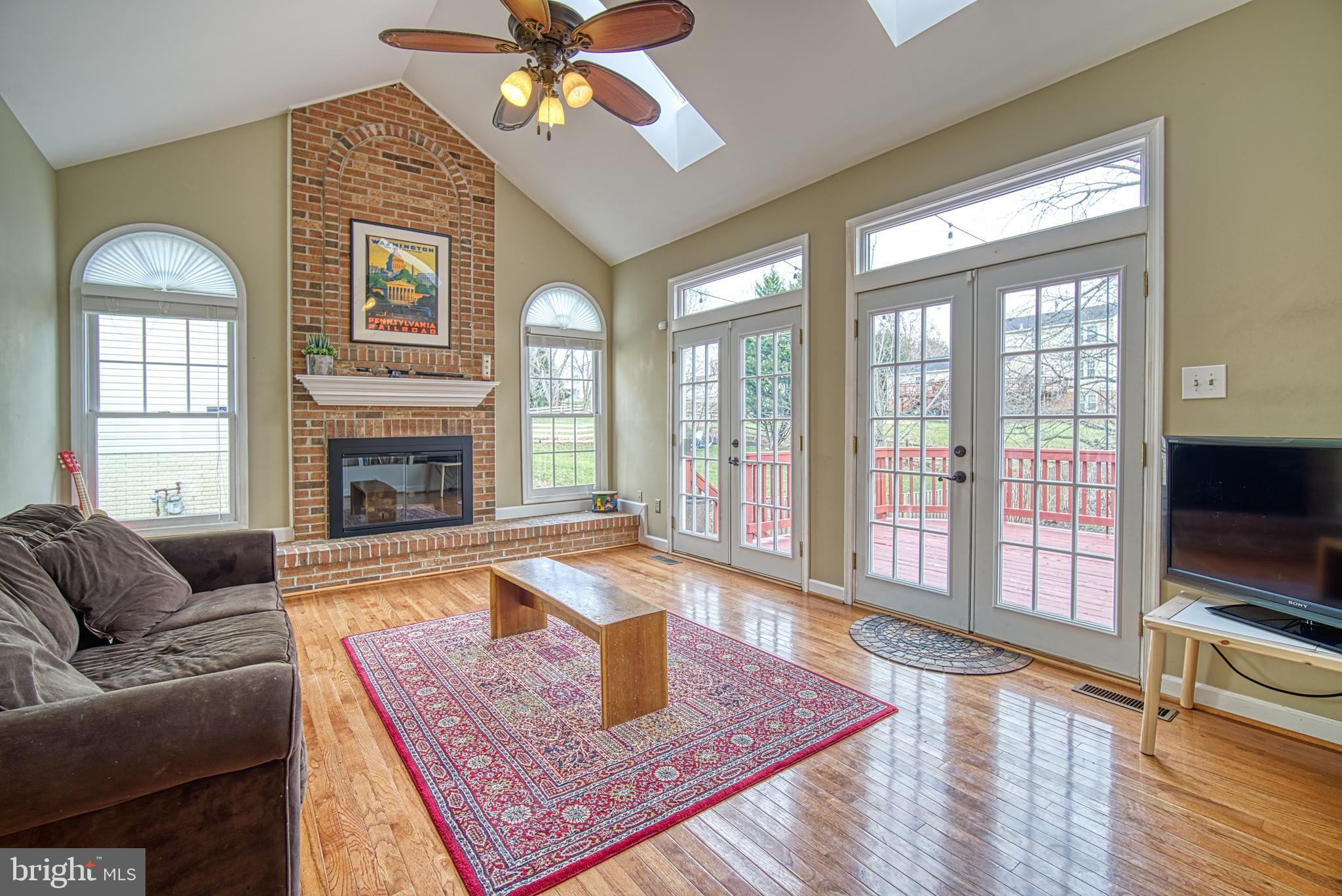 14539 Cutstone Way Silver Spring, MD 20905 - Photo 3 of 34 Stunning cathedral, brick fireplace wall