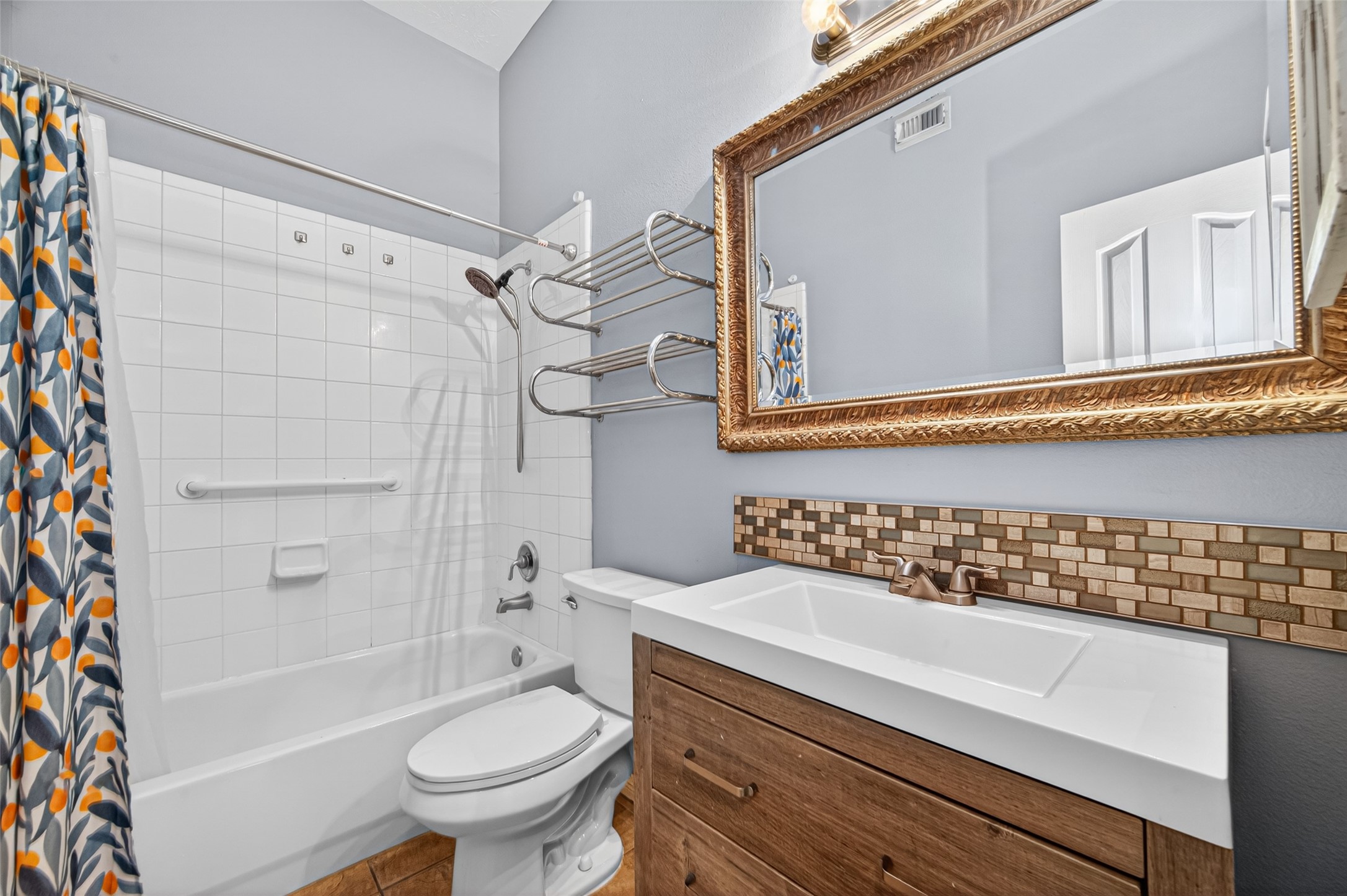 23914 Glengate Drive Spring, TX 77373 - Photo 40 of 49 a bathroom with a sink a toilet and a bathtub