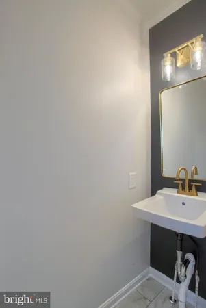 a bedroom with a bed and a chandelier fan