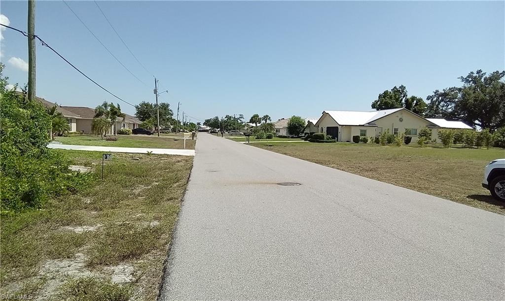 1526 Navigator Road Punta Gorda, FL 33983 - Photo 4 of 5 a view of a house with a yard and garage